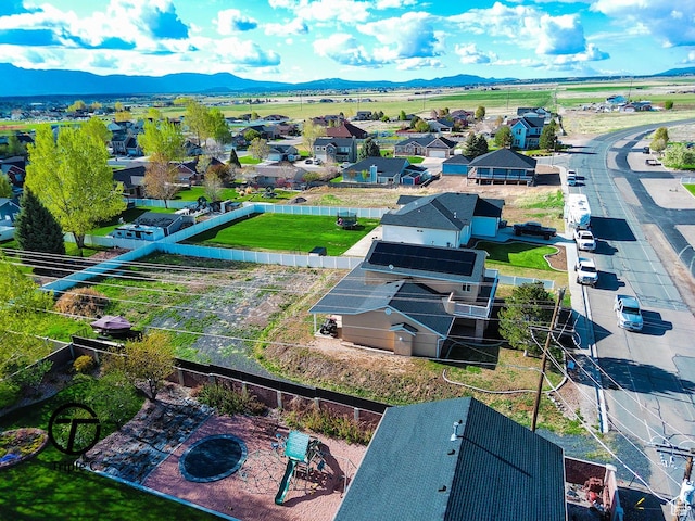 aerial perspective of suburban area featuring a mountain backdrop