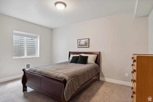 carpeted bedroom with baseboards
