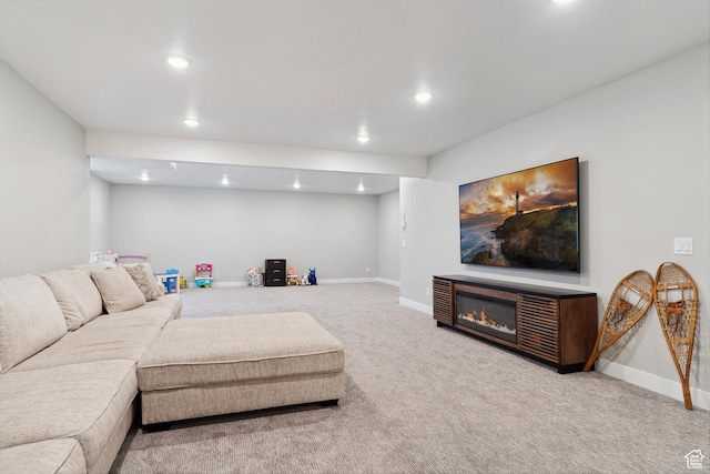 living room with carpet floors, recessed lighting, and baseboards