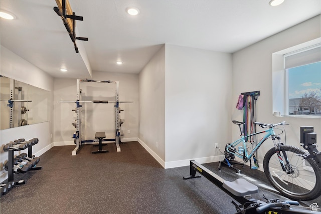workout room with baseboards and recessed lighting