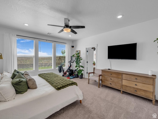 carpeted bedroom featuring recessed lighting, ceiling fan, and baseboards