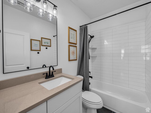 bathroom featuring toilet, vanity, and shower / bathtub combination with curtain
