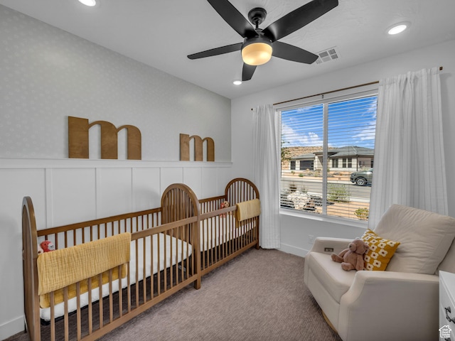 bedroom featuring carpet flooring, recessed lighting, a crib, ceiling fan, and baseboards