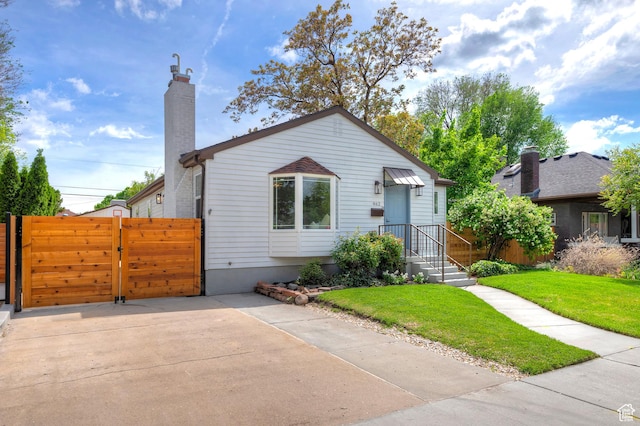462 E 1700 S, Salt Lake City, UT 84115 - bungalow-style house featuring a chimney and a gate