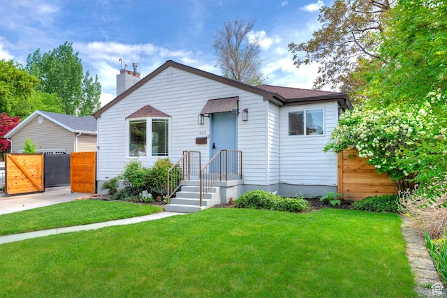 462 E 1700 S, Salt Lake City, UT 84115 - bungalow-style home featuring a gate, a chimney, and roof with shingles