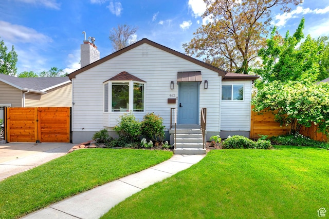 462 E 1700 S, Salt Lake City, UT 84115 - bungalow-style house featuring a gate and a chimney