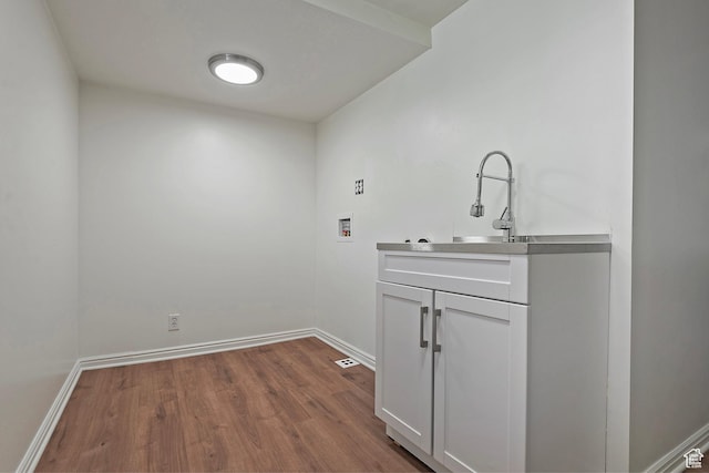 462 E 1700 S, Salt Lake City, UT 84115 - laundry area with hookup for a washing machine, dark wood finished floors, cabinet space, and baseboards