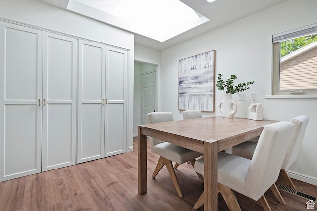 462 E 1700 S, Salt Lake City, UT 84115 - dining area with light wood-style floors, a skylight, and baseboards