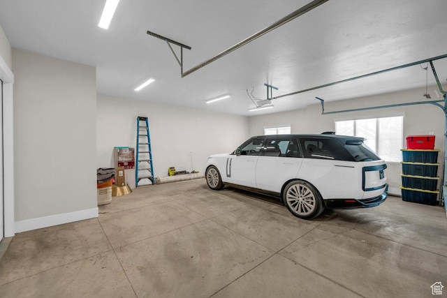 762 E Arina Way, Washington, UT 84780 - garage featuring baseboards and a garage door opener