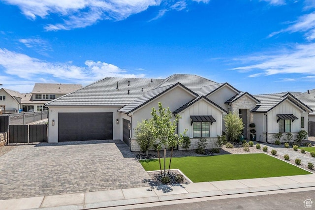 762 E Arina Way, Washington, UT 84780 - ranch-style house with a garage, board and batten siding, decorative driveway, stone siding, and stucco siding
