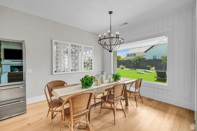 762 E Arina Way, Washington, UT 84780 - dining space with wood-type flooring, a chandelier, and baseboards