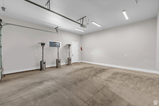 762 E Arina Way, Washington, UT 84780 - garage featuring a garage door opener and baseboards