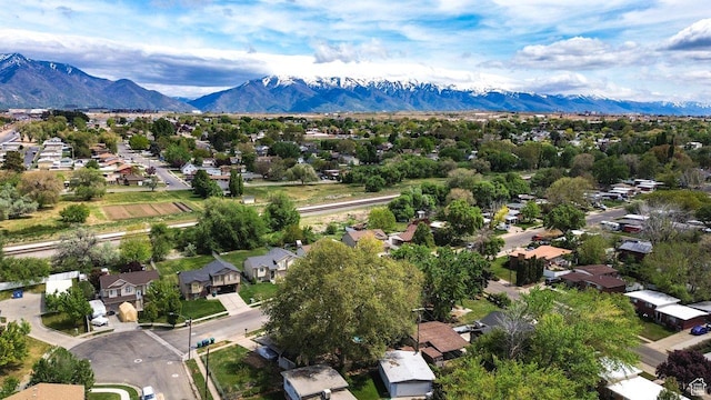 aerial view of residential area featuring a mountain backdrop