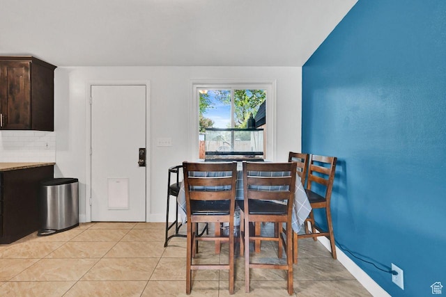 dining space with light tile patterned flooring