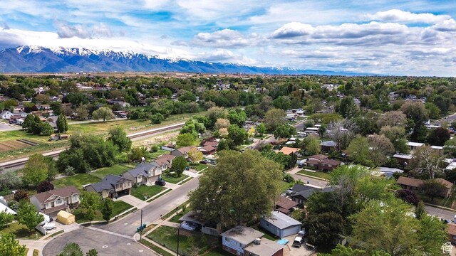 aerial view of residential area featuring a mountainous background