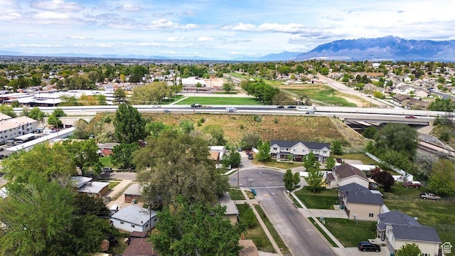 aerial view of residential area featuring a mountain backdrop