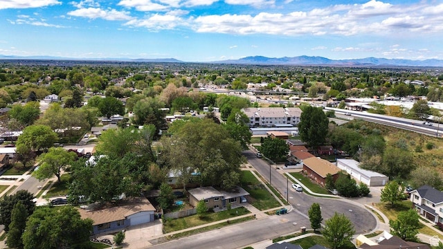 aerial view of residential area featuring a mountainous background