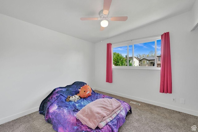 bedroom with carpet flooring, baseboards, and ceiling fan