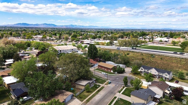 aerial view of residential area featuring a mountainous background