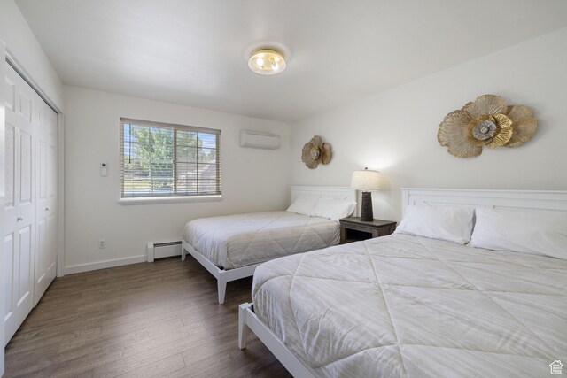 1890 W Rock Hollow Rd, Bluffdale, UT 84065 - bedroom with wood finished floors, an AC wall unit, a baseboard radiator, baseboards, and a closet