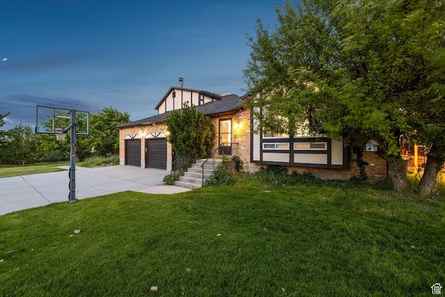 1890 W Rock Hollow Rd, Bluffdale, UT 84065 - view of front of home with concrete driveway, a garage, a front yard, and brick siding