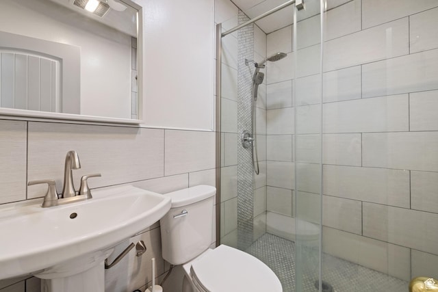 1890 W Rock Hollow Rd, Bluffdale, UT 84065 - full bath featuring tile walls, a sink, toilet, and a shower stall