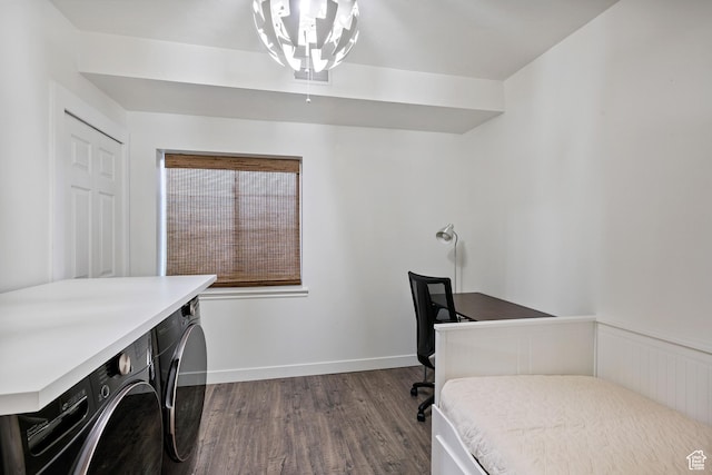 bedroom featuring separate washer and dryer, dark wood-style floors, baseboards, and a chandelier