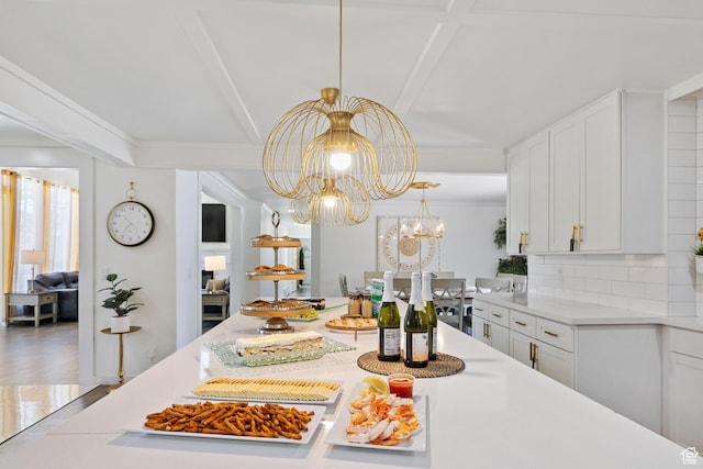 1890 W Rock Hollow Rd, Bluffdale, UT 84065 - dining space with a chandelier, beam ceiling, and ornamental molding