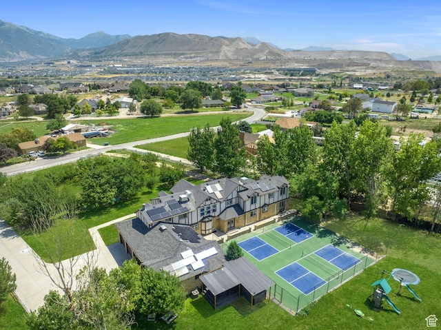 aerial perspective of suburban area with a mountainous background