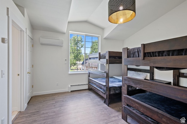 bedroom featuring an AC wall unit, a baseboard heating unit, wood finished floors, lofted ceiling, and baseboards