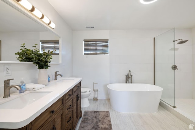 1890 W Rock Hollow Rd, Bluffdale, UT 84065 - full bathroom with double vanity, a freestanding bath, a tile shower, and toilet
