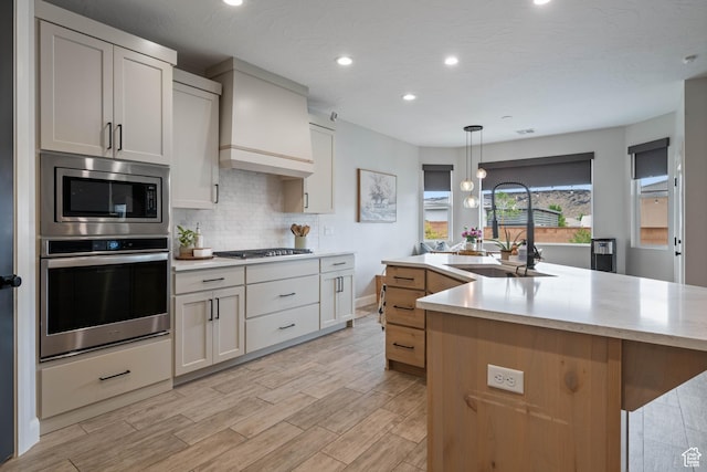 2883 S 3640 W, Hurricane, UT 84737 - kitchen featuring stainless steel appliances, a sink, decorative backsplash, recessed lighting, and light wood-style flooring
