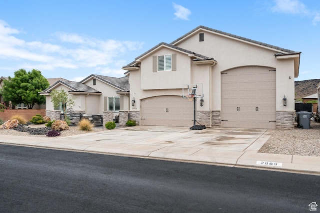 2883 S 3640 W, Hurricane, UT 84737 - view of front facade with stone siding, stucco siding, driveway, and fence