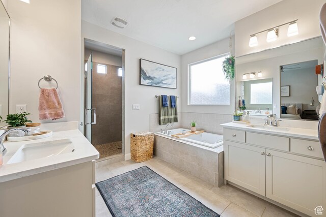 2883 S 3640 W, Hurricane, UT 84737 - bathroom with tile patterned floors, two vanities, a stall shower, and a garden tub