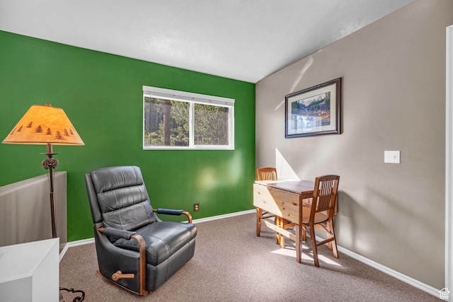 sitting room with baseboards and carpet floors