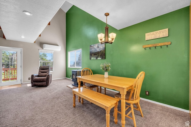 carpeted dining space featuring a wall mounted AC, a chandelier, baseboards, lofted ceiling, and a textured ceiling