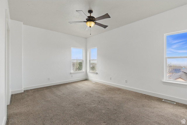 14349 S Round Rock Dr, Herriman, UT 84096 - carpeted empty room with plenty of natural light, ceiling fan, and baseboards