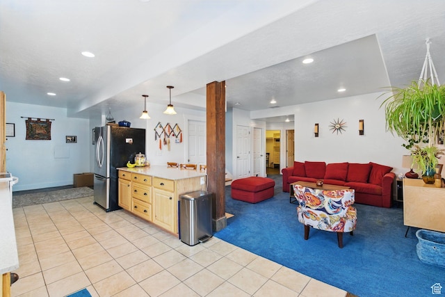 14349 S Round Rock Dr, Herriman, UT 84096 - living room with light tile patterned floors, recessed lighting, and light carpet