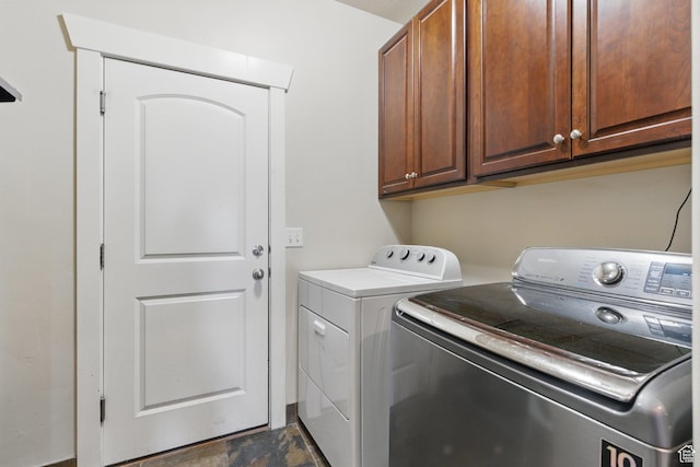 14349 S Round Rock Dr, Herriman, UT 84096 - laundry room with independent washer and dryer, cabinet space, and dark stone finish flooring