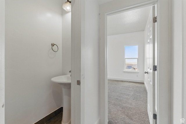 14349 S Round Rock Dr, Herriman, UT 84096 - bathroom with baseboards and a sink