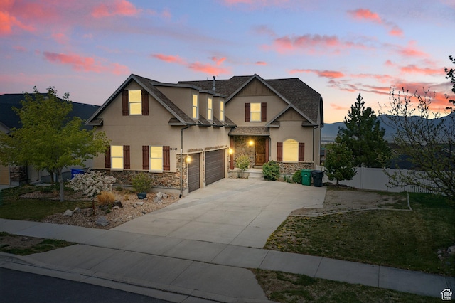 14349 S Round Rock Dr, Herriman, UT 84096 - traditional home featuring fence, stucco siding, concrete driveway, and stone siding