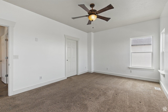 14349 S Round Rock Dr, Herriman, UT 84096 - spare room with carpet floors, a ceiling fan, and baseboards