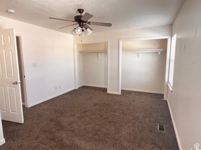354 E 950 S, Payson, UT 84651 - unfurnished bedroom with two closets, dark carpet, a textured ceiling, ceiling fan, and baseboards