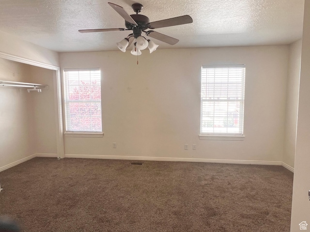 354 E 950 S, Payson, UT 84651 - unfurnished bedroom with a textured ceiling, carpet flooring, multiple windows, and a closet