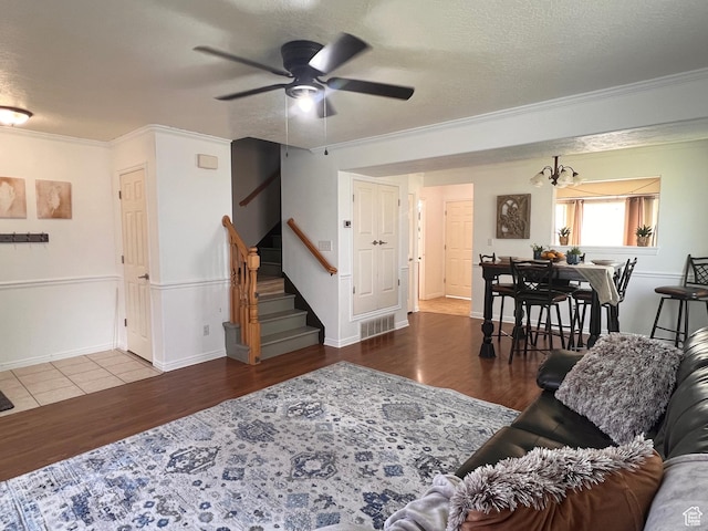354 E 950 S, Payson, UT 84651 - living area with wood finished floors, crown molding, ceiling fan, stairs, and baseboards