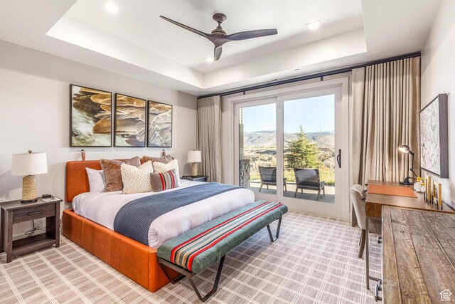 7485 E Moon Light Dr, Heber City, UT 84032 - bedroom featuring a raised ceiling, access to outside, light carpet, and ceiling fan