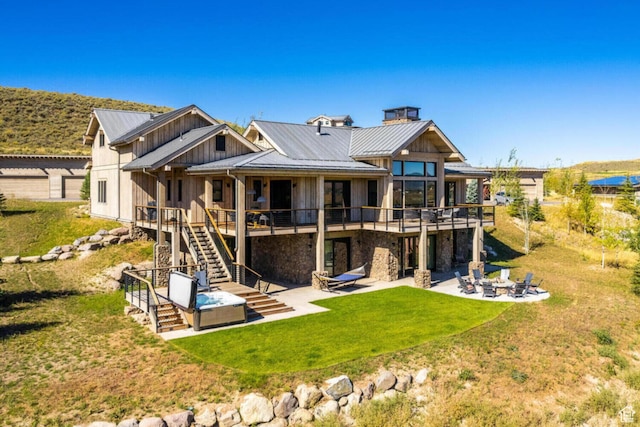7485 E Moon Light Dr, Heber City, UT 84032 - rear view of house featuring a patio, board and batten siding, a fire pit, stairs, and a deck