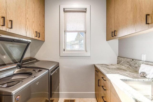 7485 E Moon Light Dr, Heber City, UT 84032 - laundry area featuring cabinet space, washing machine and clothes dryer, and baseboards