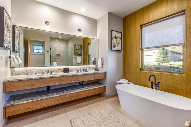 7485 E Moon Light Dr, Heber City, UT 84032 - bathroom featuring a stall shower, a freestanding bath, double vanity, baseboards, and tile patterned floors