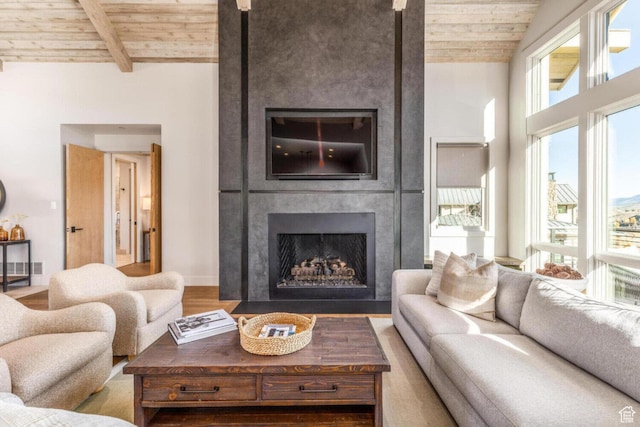 7485 E Moon Light Dr, Heber City, UT 84032 - living room featuring wood ceiling, a fireplace, wood finished floors, and beamed ceiling